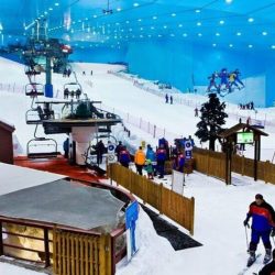 Family having fun on the ski slopes and snow park at Ski Dubai