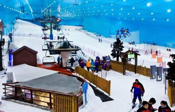 Family having fun on the ski slopes and snow park at Ski Dubai