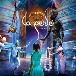 Alt text for the image of La Perle by Dragone Dubai could be "A spectacular scene from the La Perle live show in Dubai, featuring acrobats performing in mid-air against a backdrop of colorful lights and special effects.