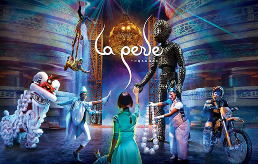 Alt text for the image of La Perle by Dragone Dubai could be "A spectacular scene from the La Perle live show in Dubai, featuring acrobats performing in mid-air against a backdrop of colorful lights and special effects.