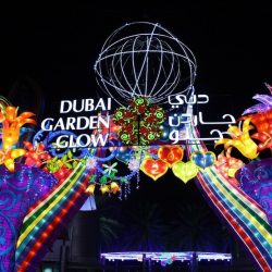 Colorful illuminated garden with bright flowers, trees and animals at Glow Garden Dubai