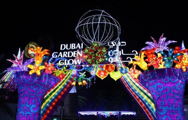 Colorful illuminated garden with bright flowers, trees and animals at Glow Garden Dubai