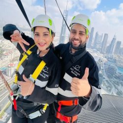 Sky Views Edge Walk Dubai at Address Sky View Observatory: Adrenaline-pumped walk outside with safety harness, 360-degree panoramic view of Dubai's skyline, glass bridge, patient instructor, Burj Khalifa, Dubai Frame, 52nd level, 22m above ground level.