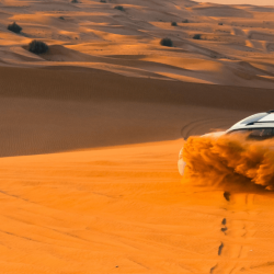 Image of a luxury 4x4 vehicle in the desert during a private morning safari in Dubai.