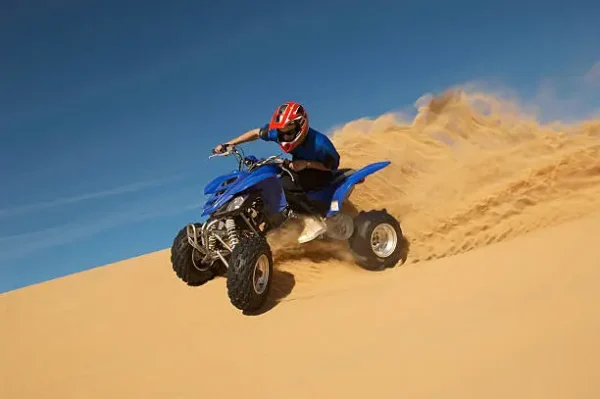 Morning desert safari with atv quad bike